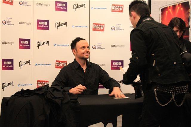 Paul Landers in 2012 signing autographs at the British Music Experience's Gibson booth
